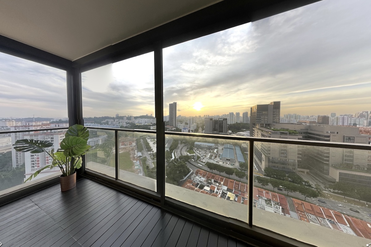 Private balcony with panoramic city views and outdoor furniture
